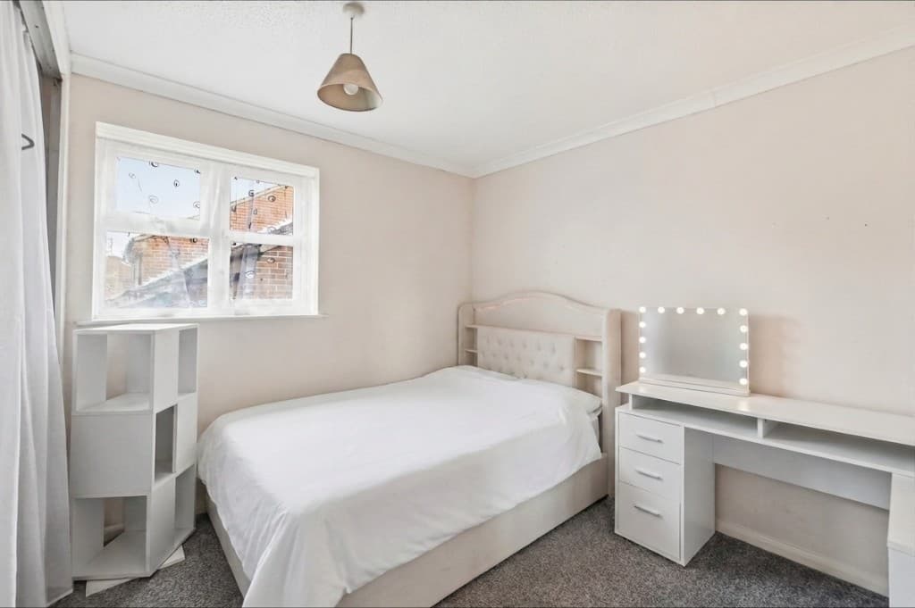 The same bedroom cleared of clutter and tidied by PhotoClear