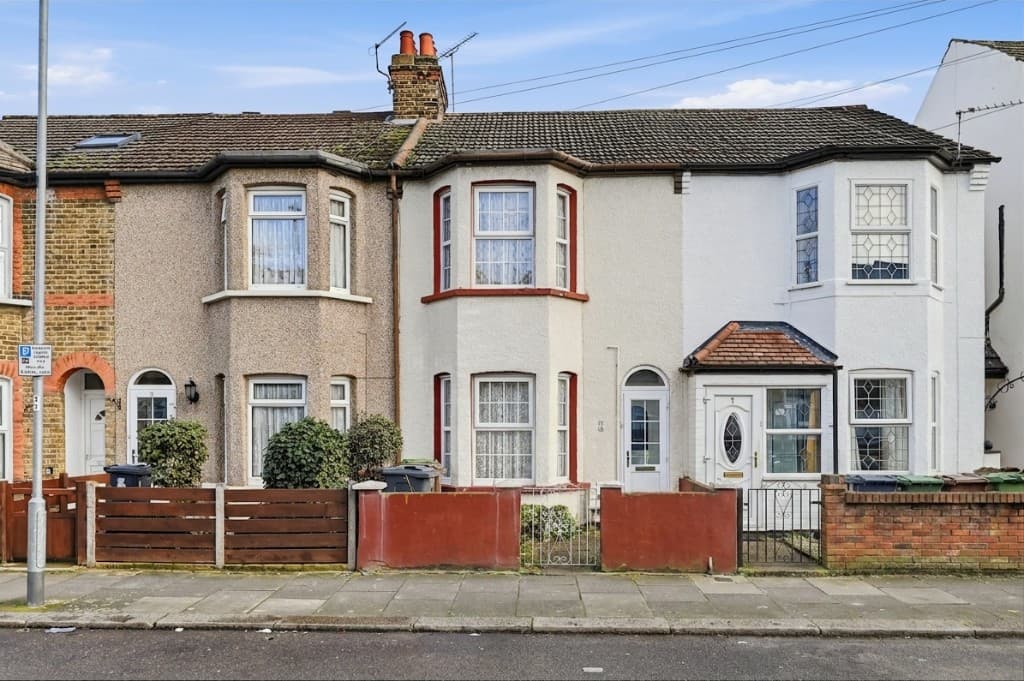The same house with the car, bins and for-sale board removed by PhotoClear